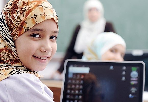 Smiling girl using a tablet